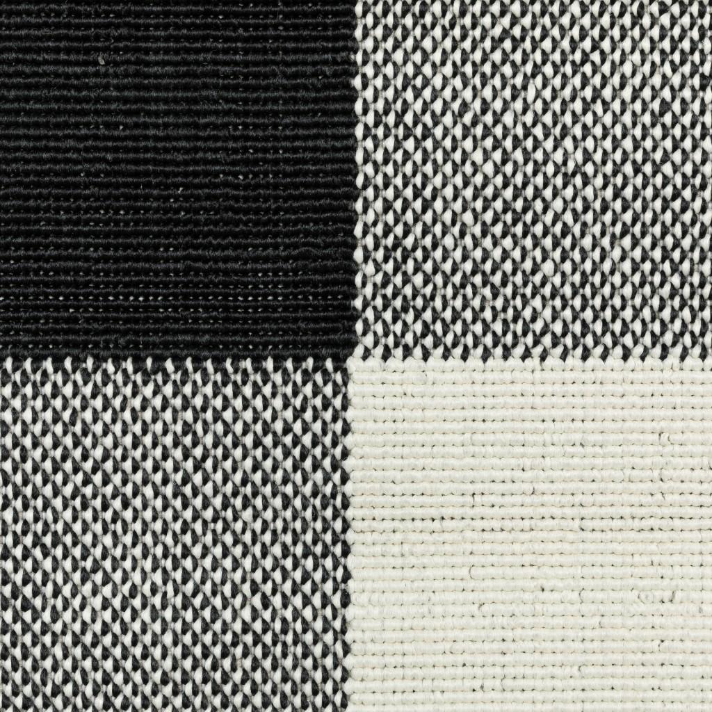 2' X 4' Black And Ivory Indoor Outdoor Area Rug