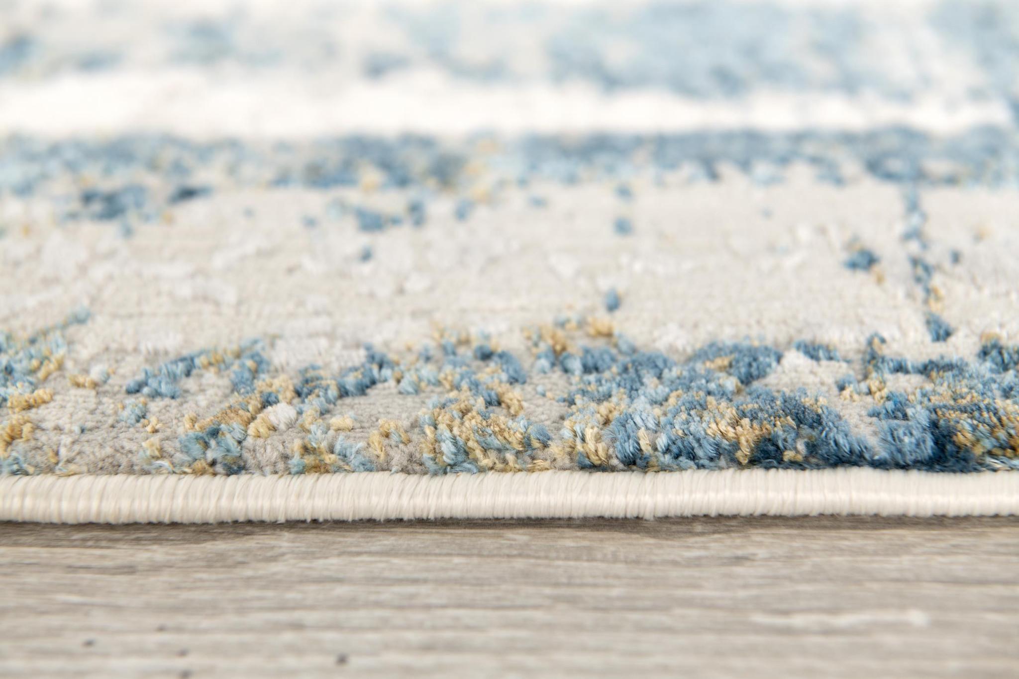 4' X 6' Blue and Ivory Abstract Power Loom Area Rug