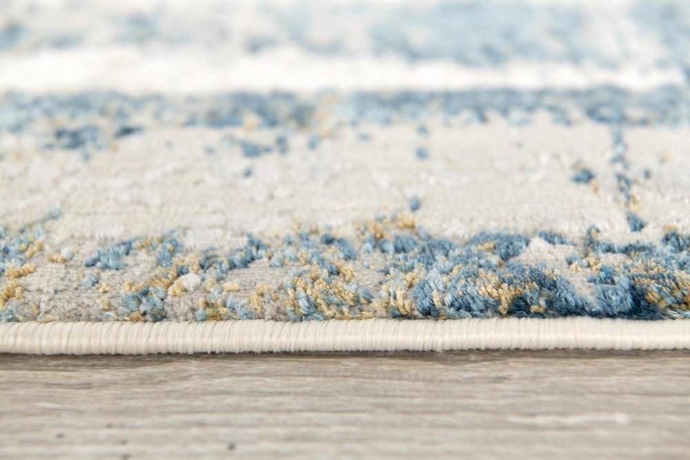 4' X 6' Blue and Ivory Abstract Power Loom Area Rug