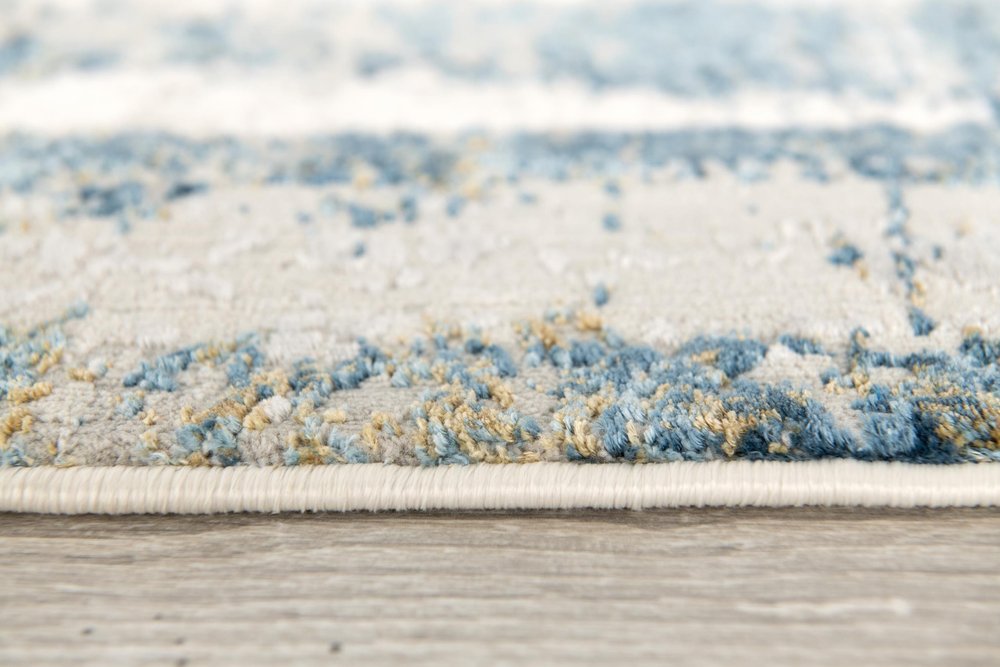 4' X 6' Blue and Ivory Abstract Power Loom Area Rug