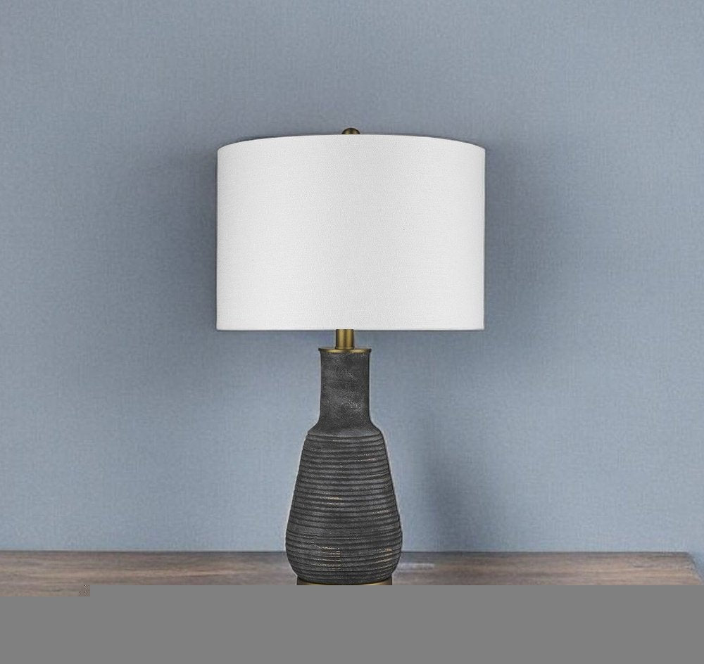 26" Distressed Black and Gold Ceramic Table Lamp With White Drum Shade