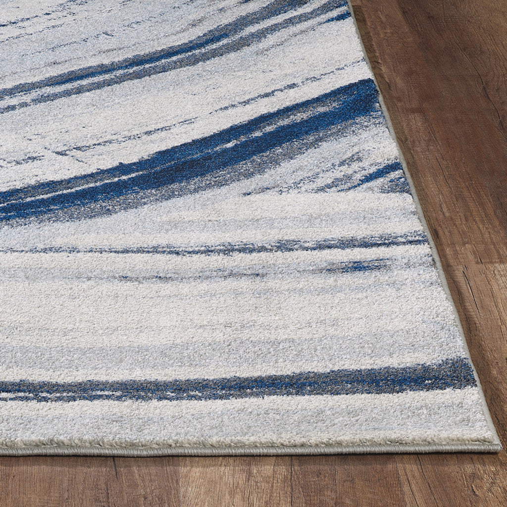 7' X 10' Ivory and Blue Abstract Area Rug