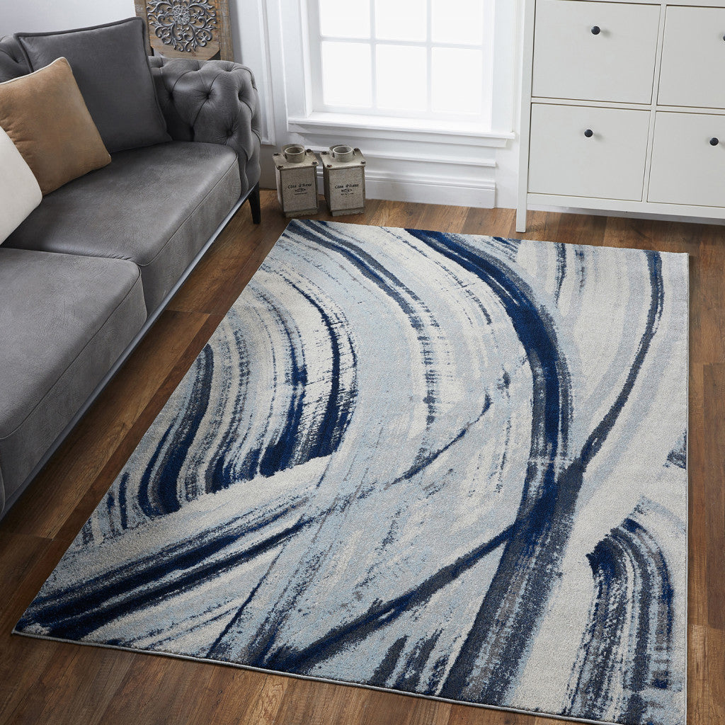 7' X 10' Ivory and Blue Abstract Area Rug