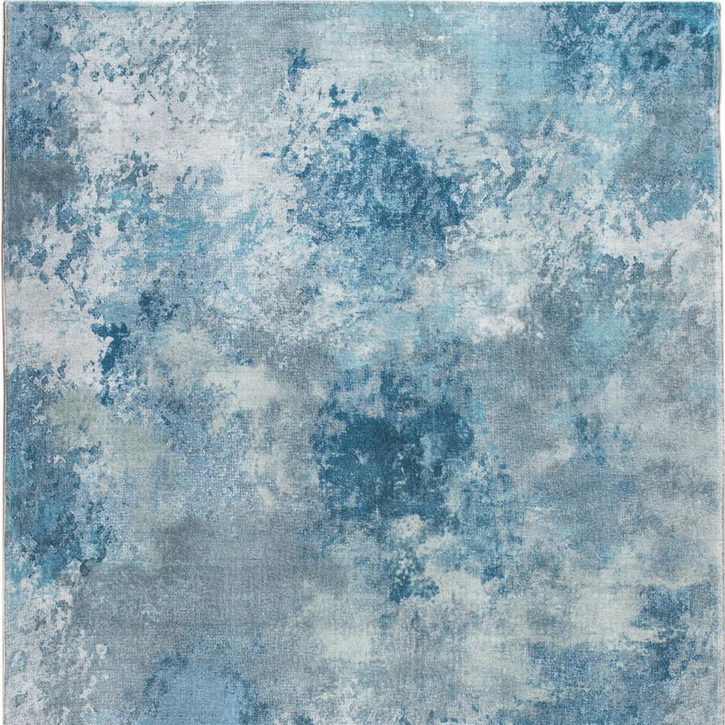 5' X 8' Blue And Ivory Abstract Area Rug