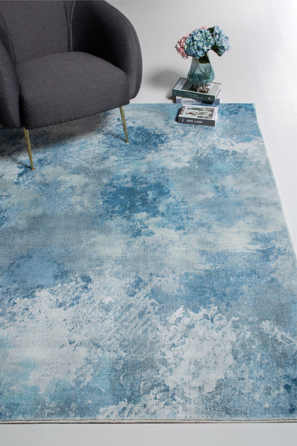 5' X 8' Blue And Ivory Abstract Area Rug