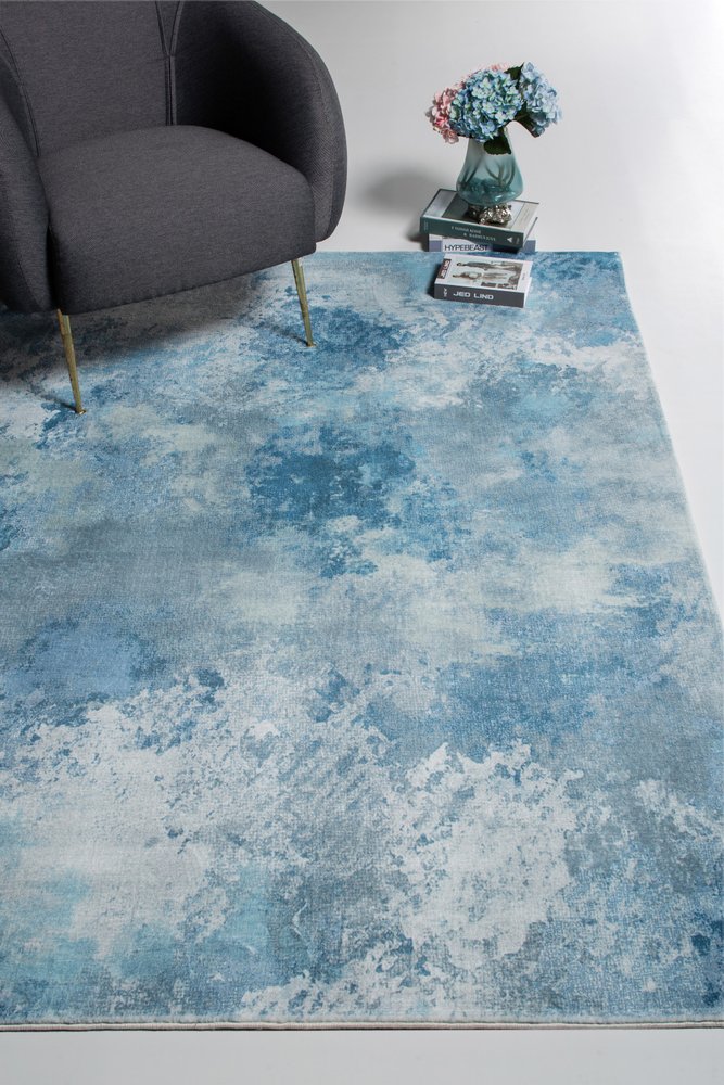 5' X 8' Blue And Ivory Abstract Area Rug