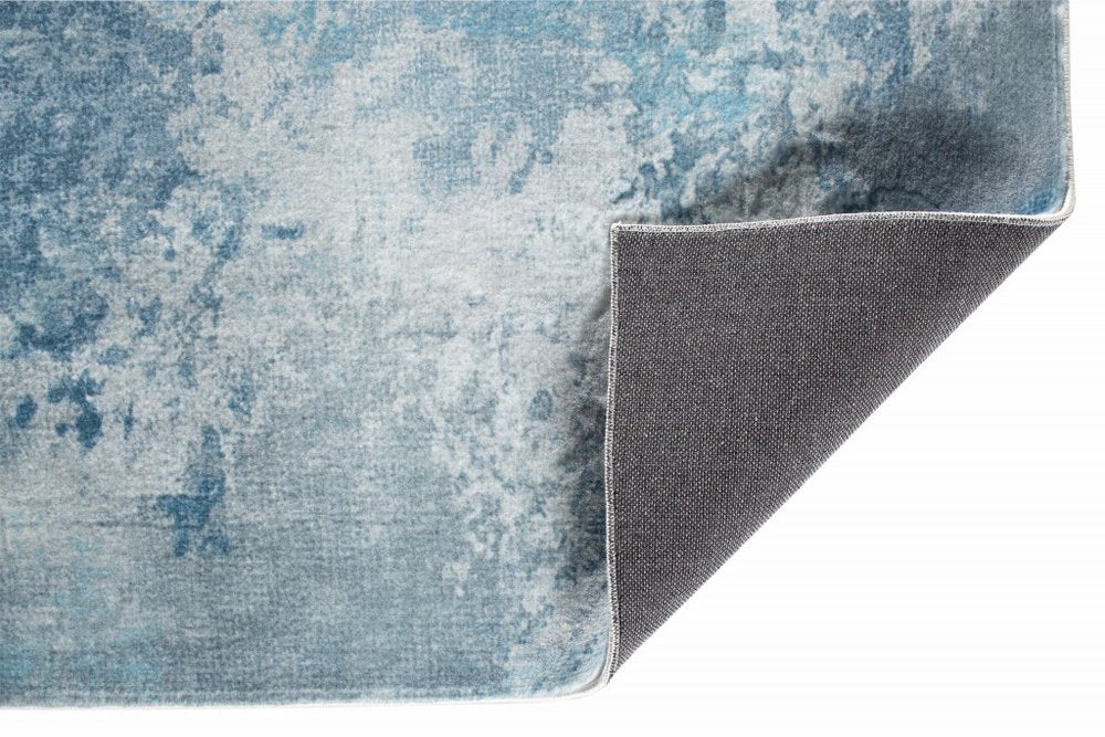 6' X 9' Blue And Ivory Abstract Area Rug