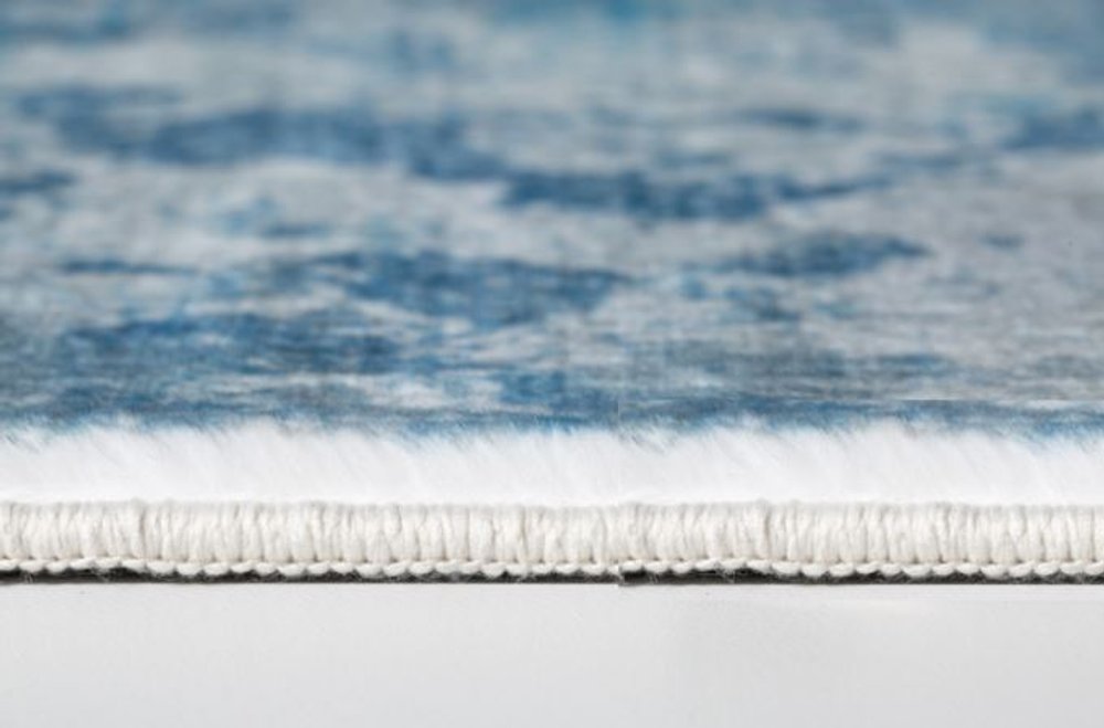 6' X 9' Blue And Ivory Abstract Area Rug