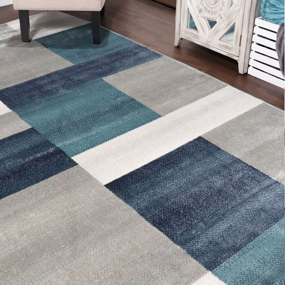 5' X 8' Teal And Ivory Patchwork Area Rug