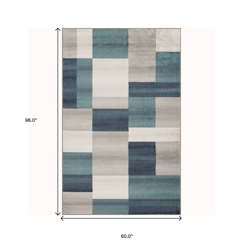 5' X 8' Teal And Ivory Patchwork Area Rug