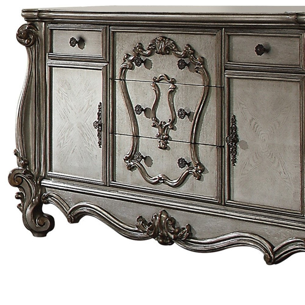 70" Platinum Carved Scrollwork Wood And Polyresin Five Drawer Triple Dresser