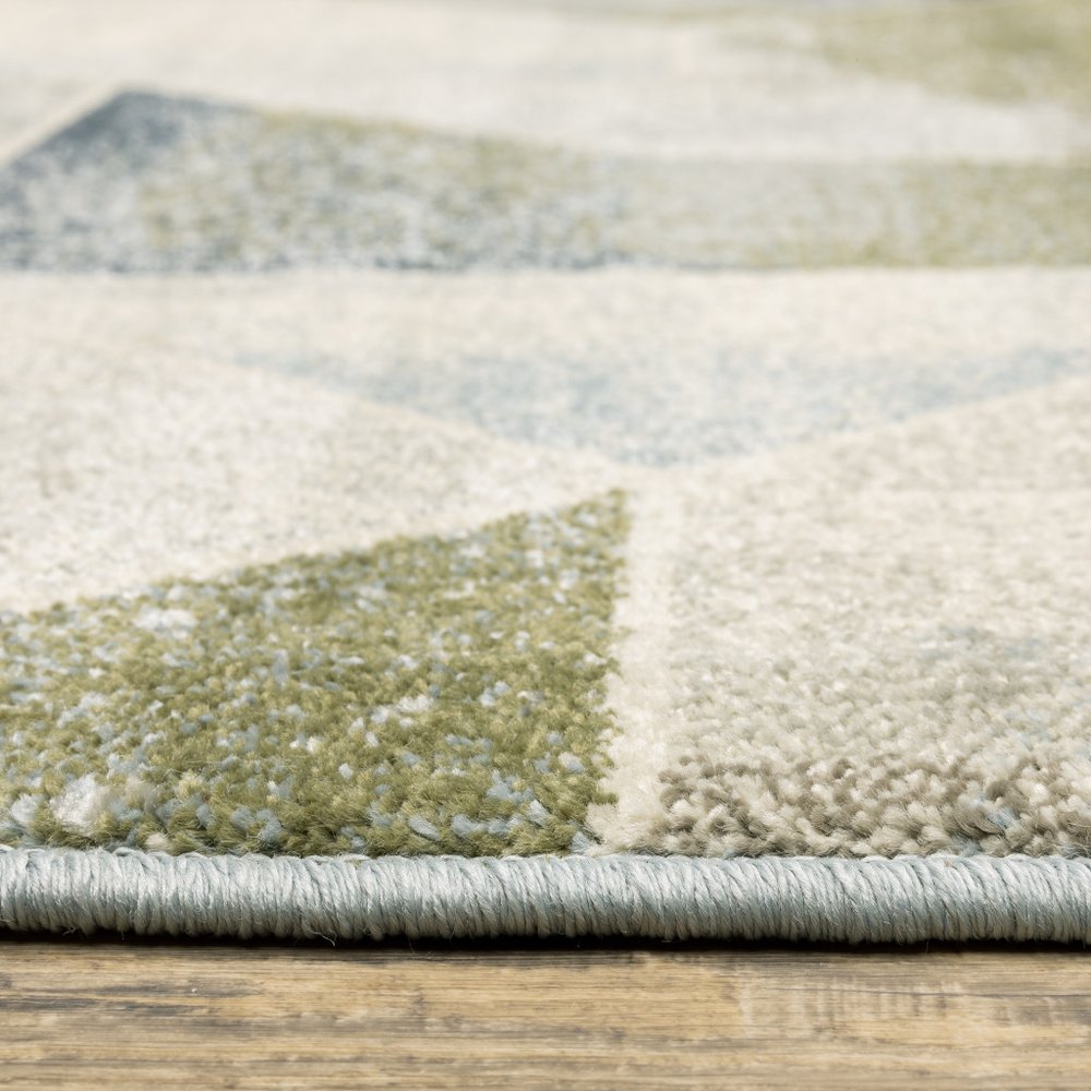 7' X 9' Gray And Ivory Geometric Area Rug