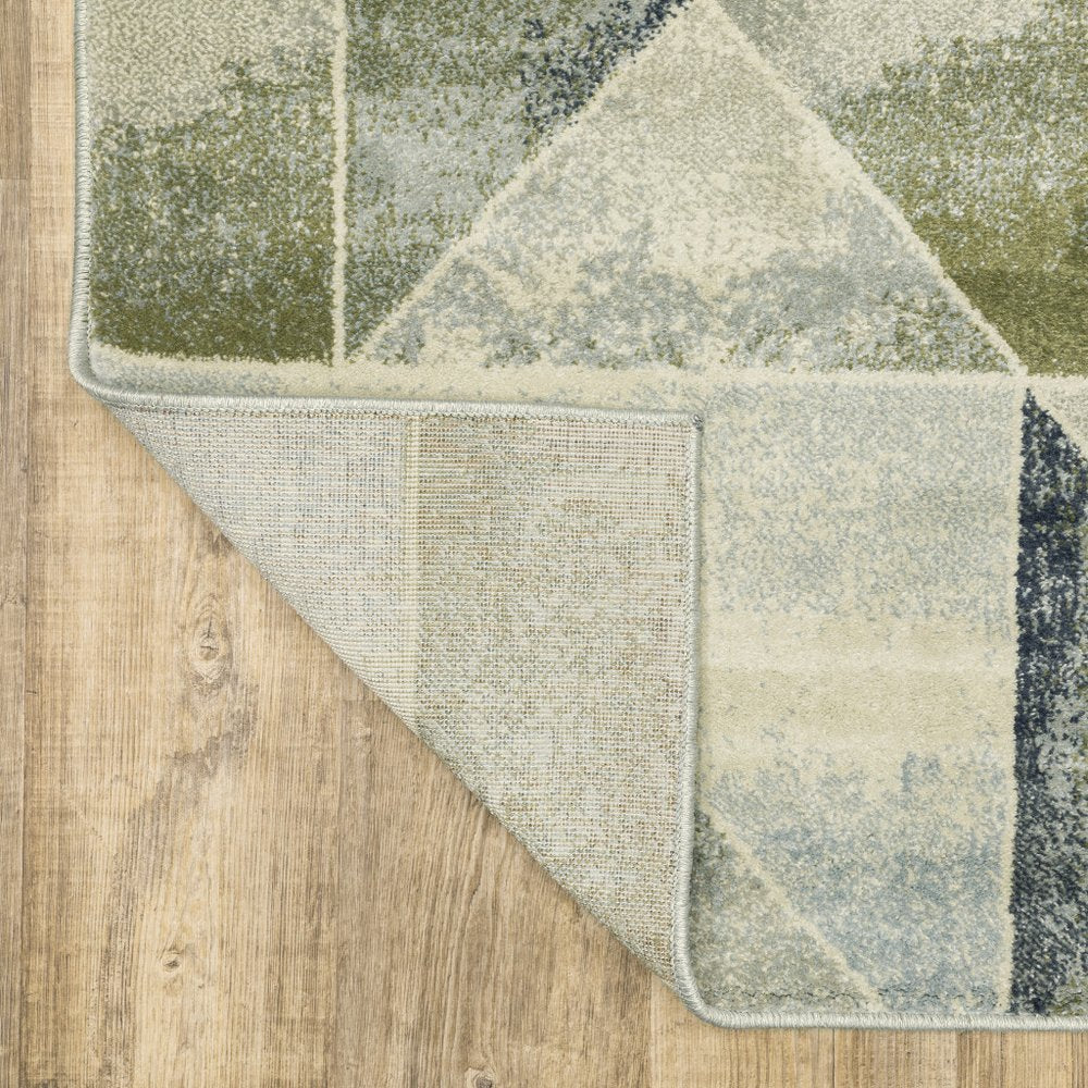 7' X 9' Gray And Ivory Geometric Area Rug