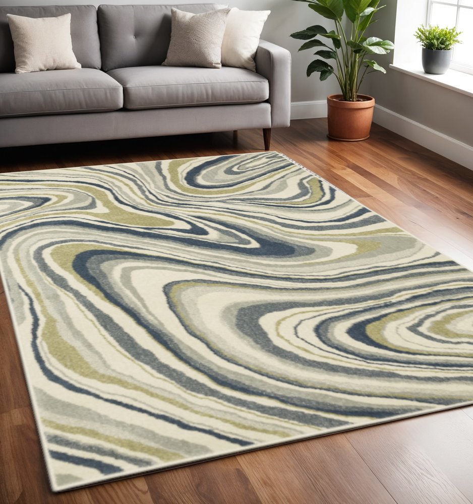 5' X 7' Ivory Blue And Beige Abstract Power Loom Stain Resistant Area Rug