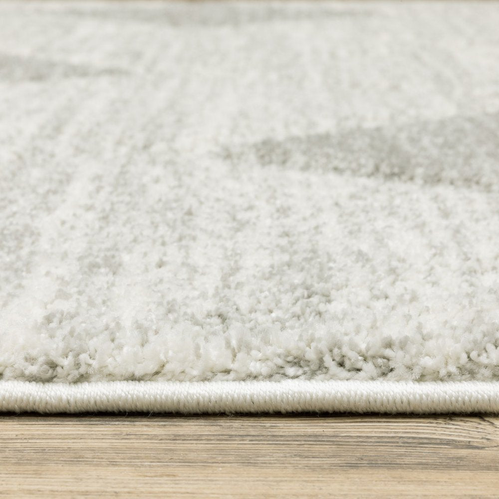 7' X 10' Gray And Ivory Geometric Area Rug