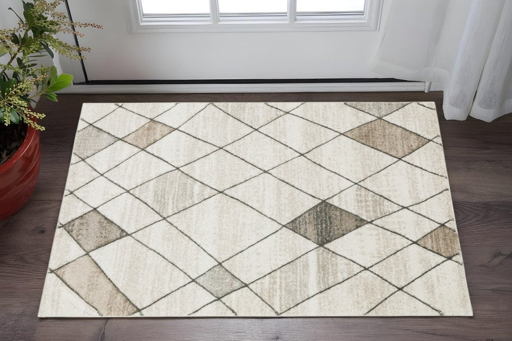 3' X 5' Beige Grey Tan And Brown Geometric Power Loom Stain Resistant Area Rug