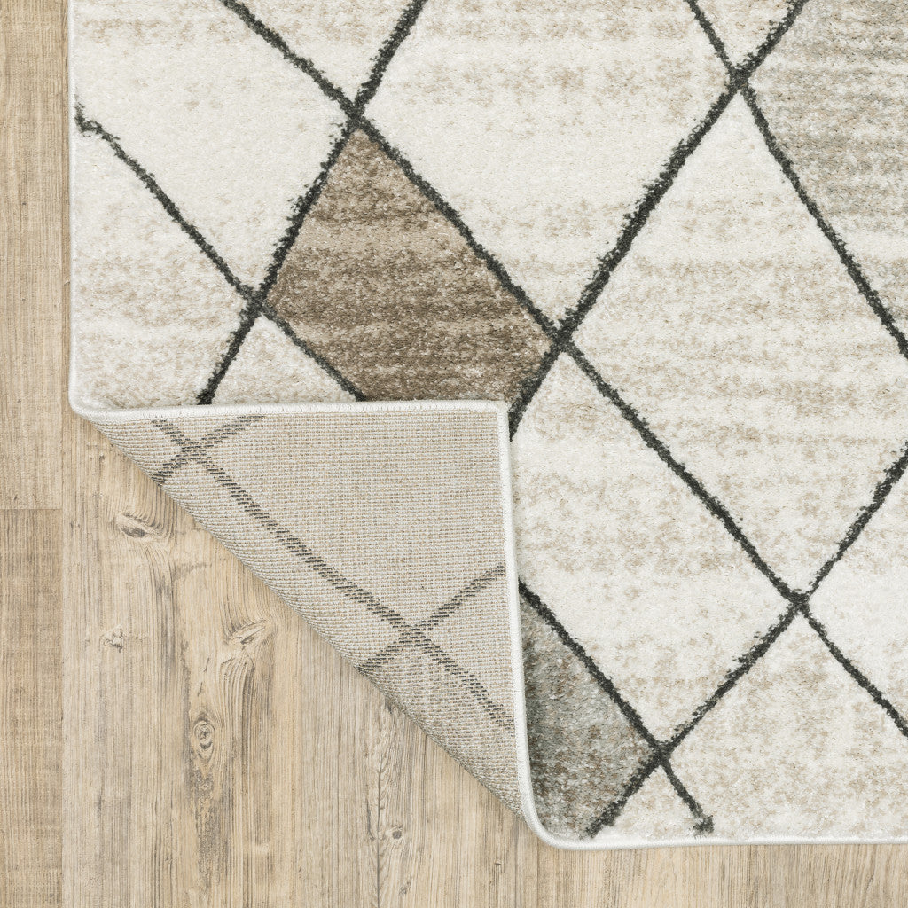 6' X 9' Beige Grey Tan And Brown Geometric Power Loom Stain Resistant Area Rug