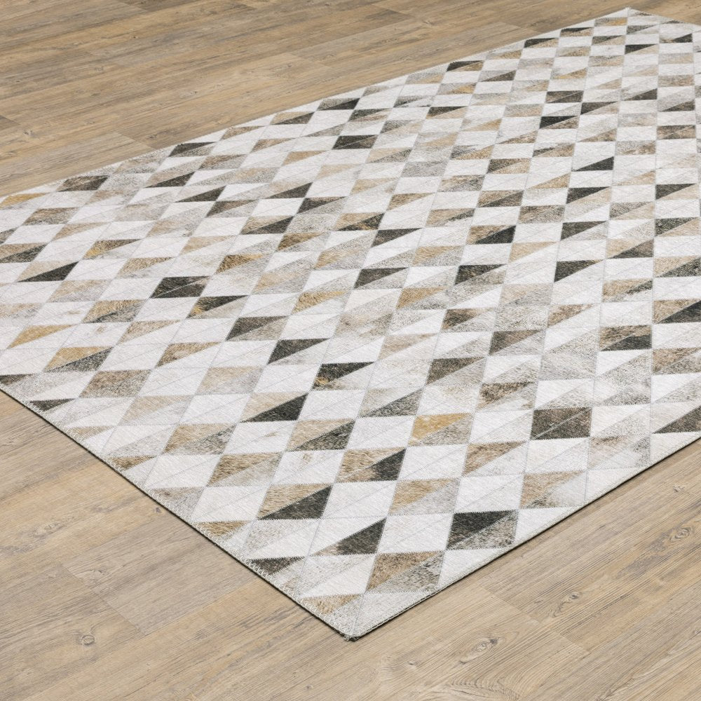5' X 7' Beige Brown Grey And Ivory Geometric Power Loom Stain Resistant Area Rug