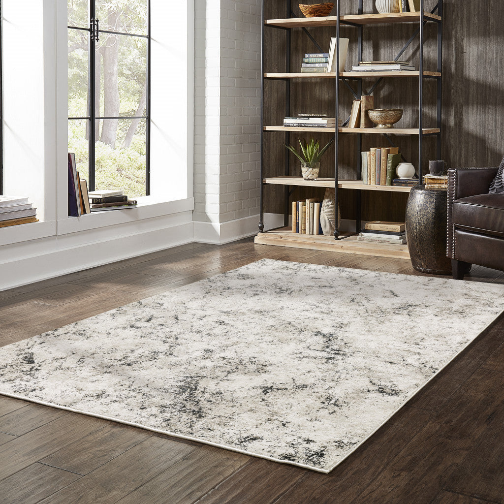 10' X 13' Ivory Grey Black Beige And Tan Abstract Power Loom Stain Resistant Area Rug