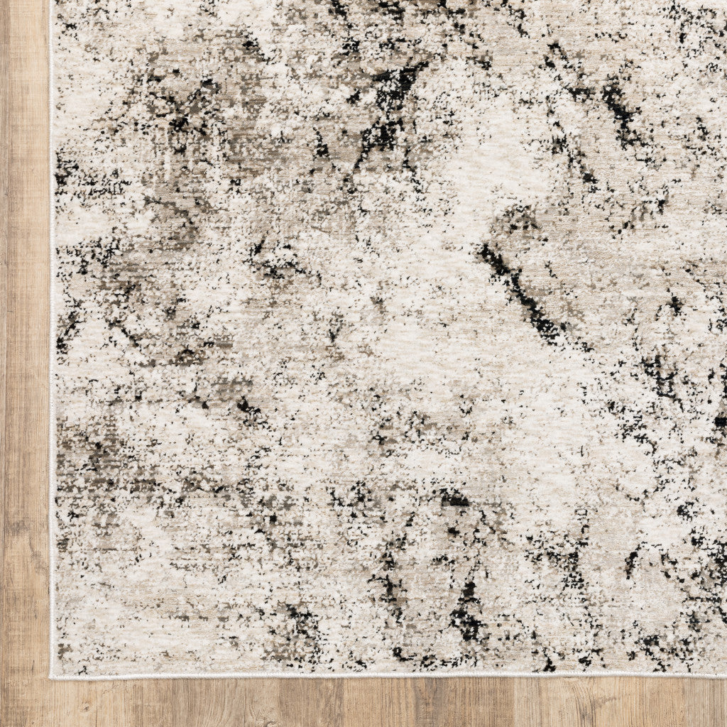 10' X 13' Ivory Grey Black Beige And Tan Abstract Power Loom Stain Resistant Area Rug