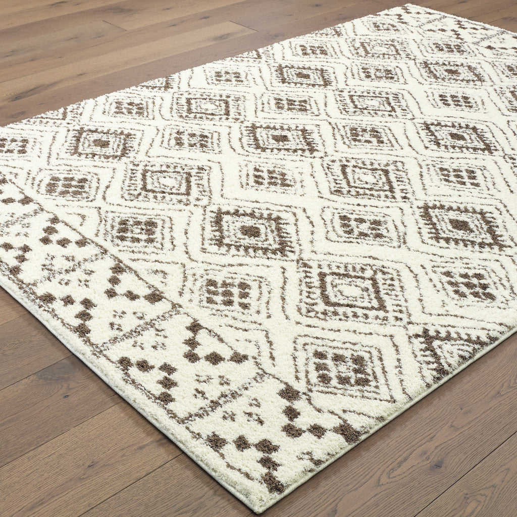 6' X 9' Ivory And Brown Geometric Shag Power Loom Stain Resistant Area Rug