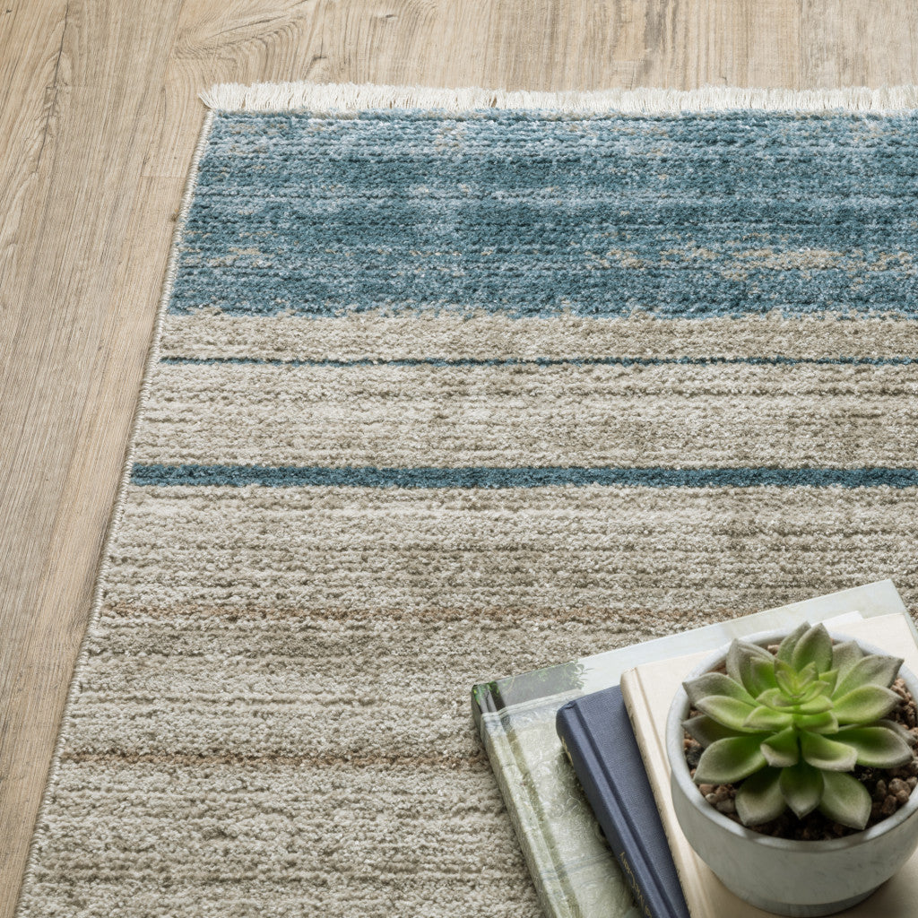 10' X 13' Blue Dark Blue Teal Grey Ivory Beige And Tan Geometric Power Loom Stain Resistant Area Rug With Fringe