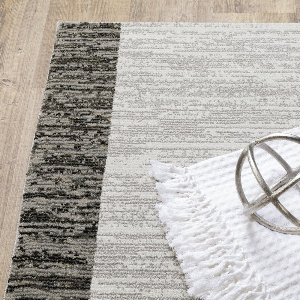 5' X 7' Gray and Ivory Geometric Power Loom Area Rug