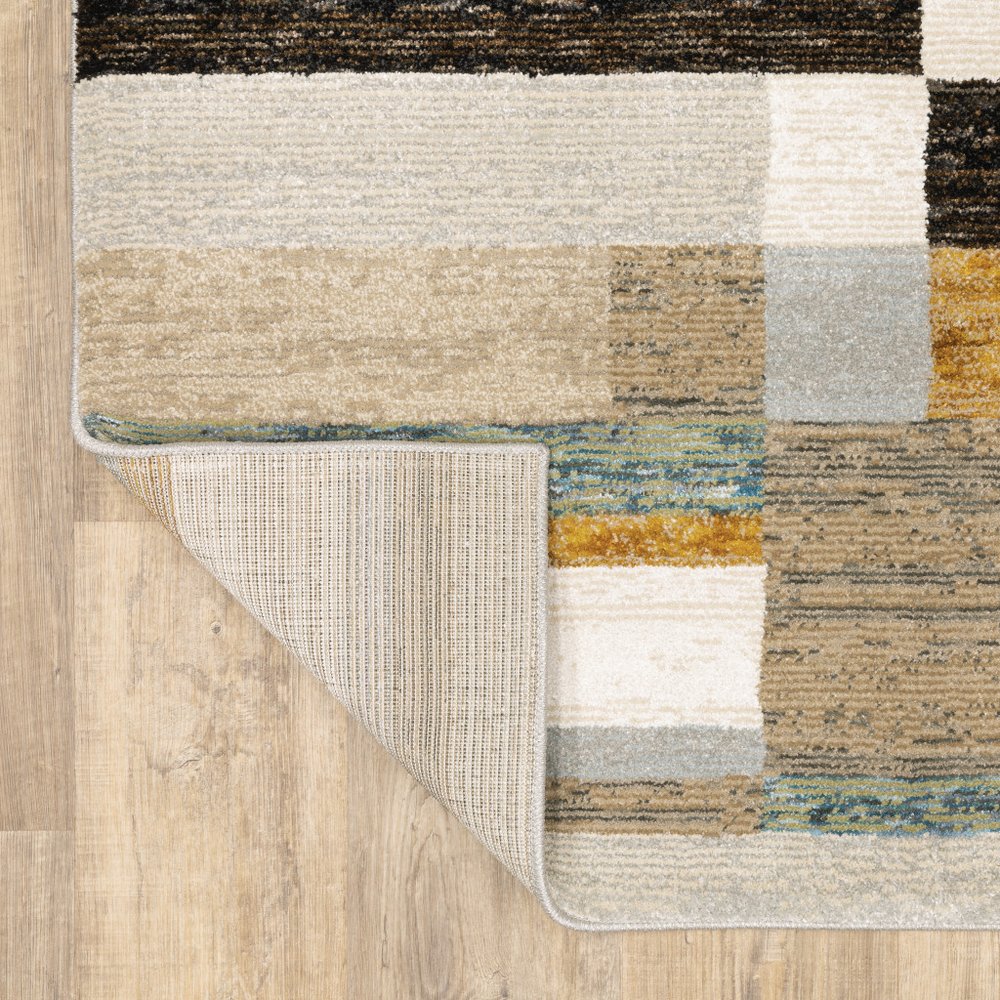 7' X 10' Beige Gold Black Grey Tan Teal and Rust Geometric Power Loom Area Rug