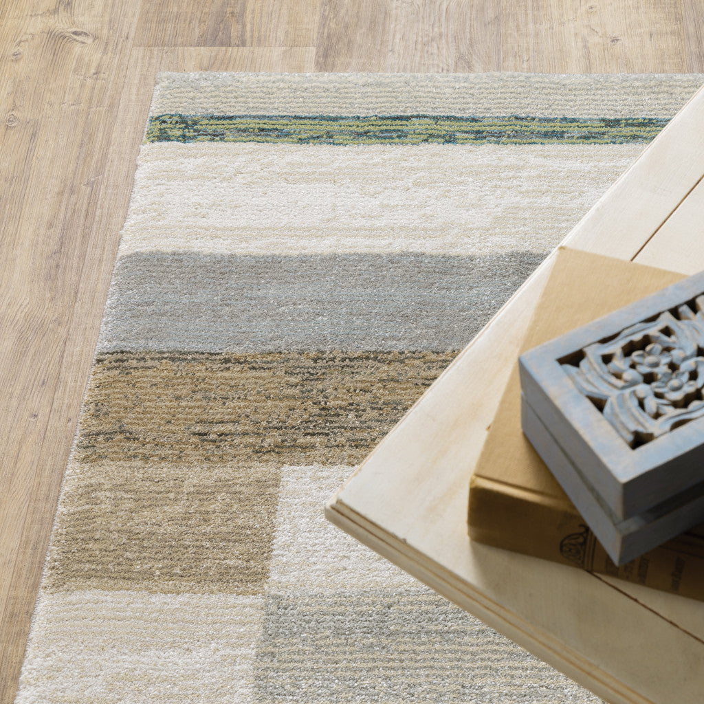 9' X 12' Beige Gold Black Grey Tan Teal And Rust Geometric Power Loom Area Rug