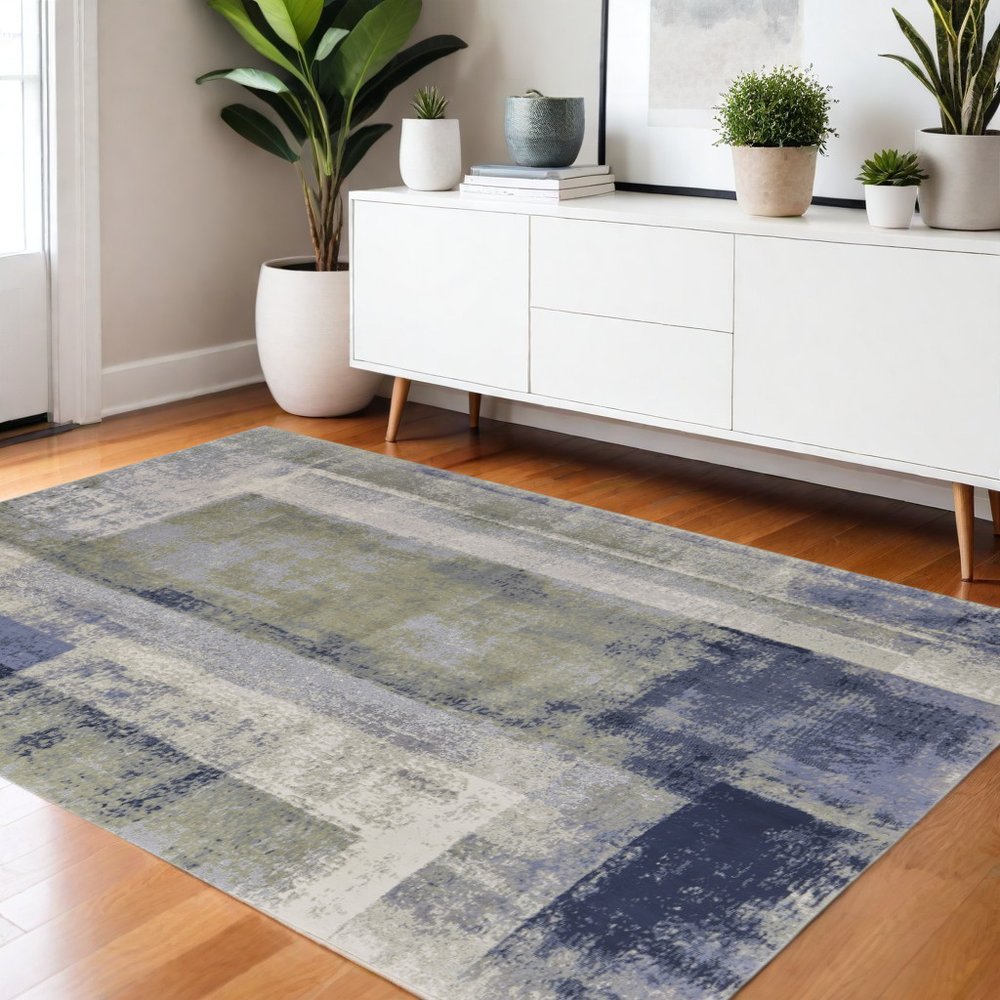 9' X 12' Blue Green And Ivory Abstract Distressed Area Rug