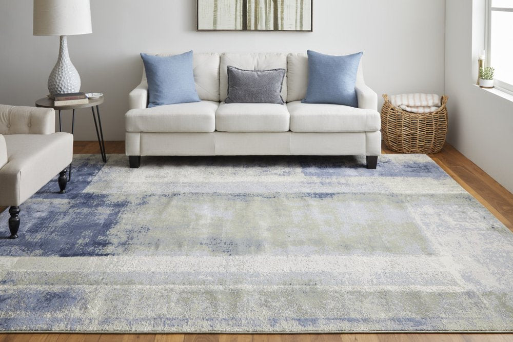 9' X 12' Blue Green And Ivory Abstract Distressed Area Rug