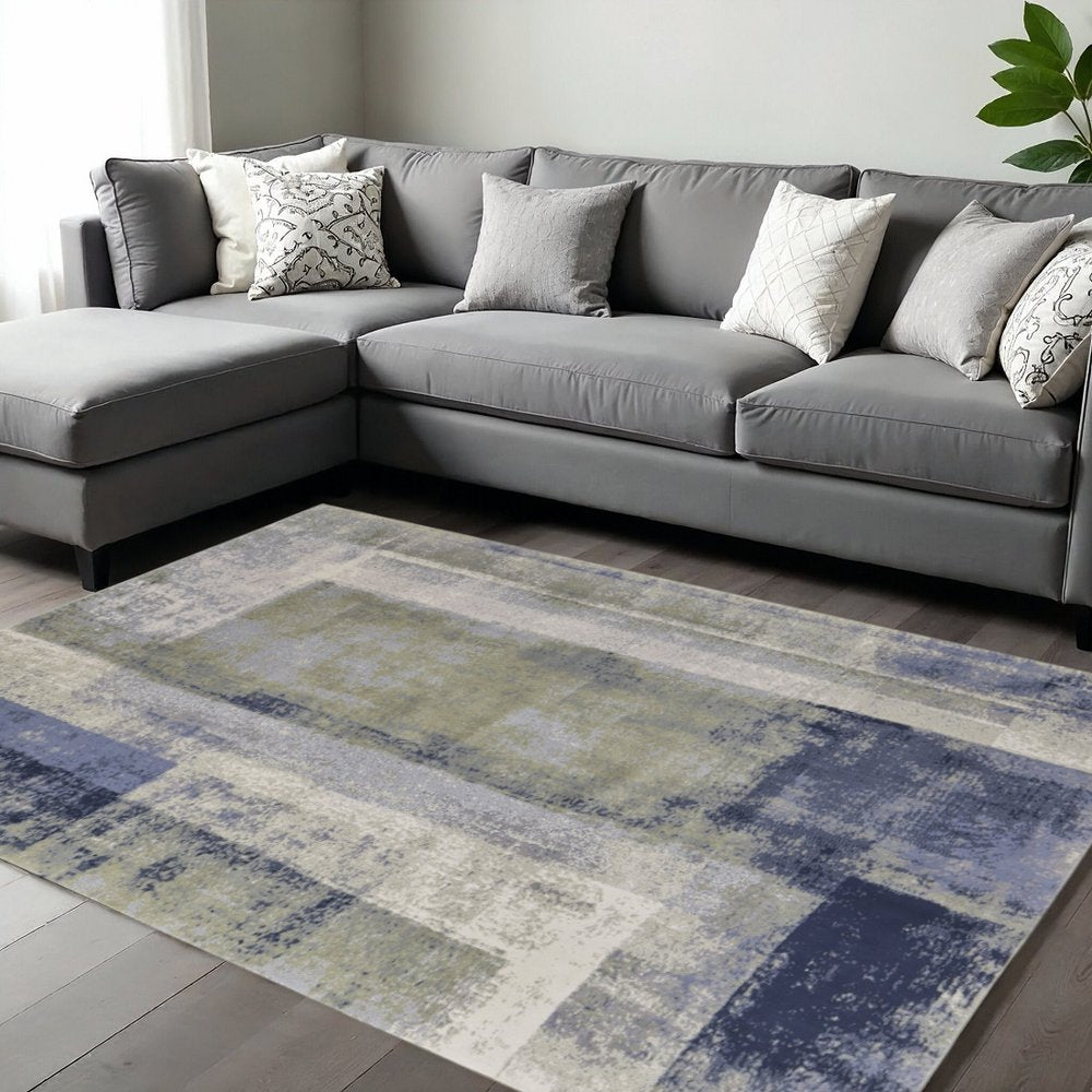 9' X 12' Blue Green And Ivory Abstract Distressed Area Rug