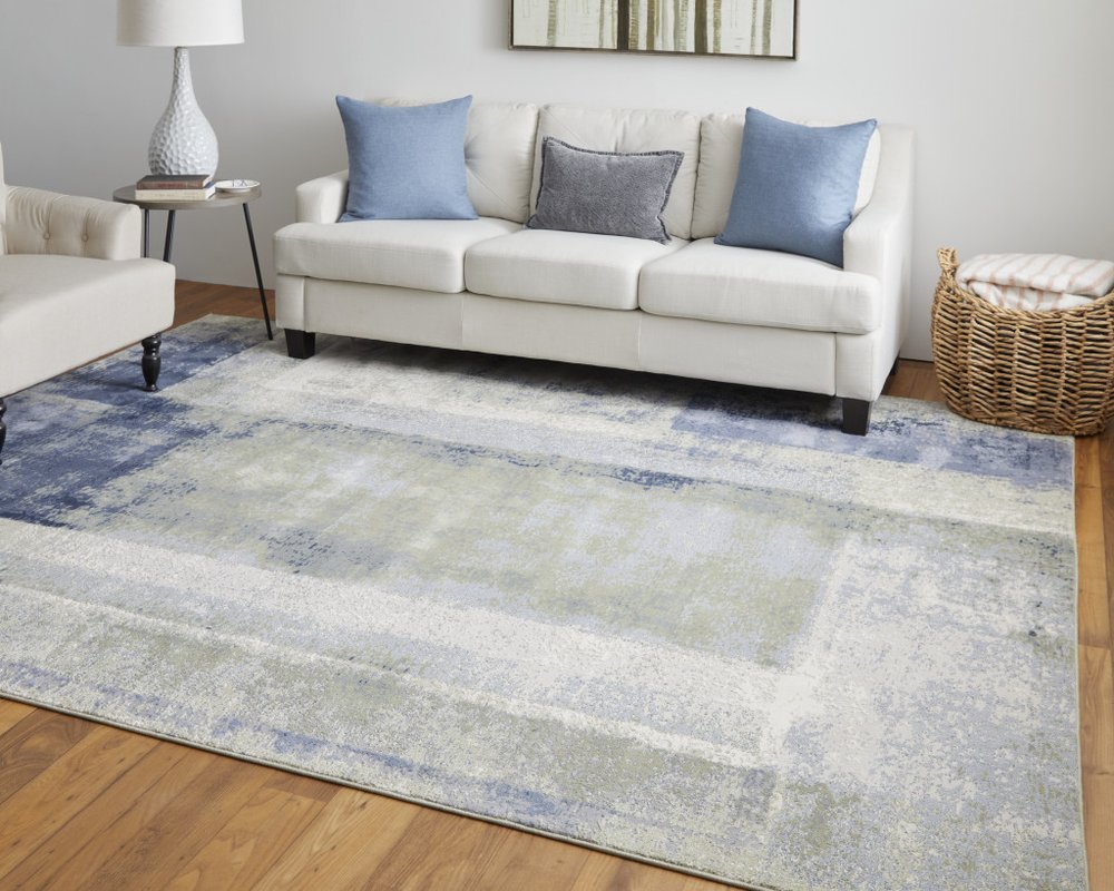 9' X 12' Blue Green And Ivory Abstract Distressed Area Rug