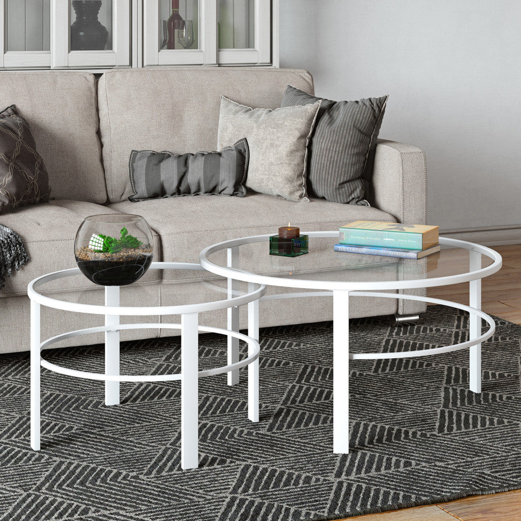 Set of Two 36" White Glass And Steel Round Nested Coffee Tables