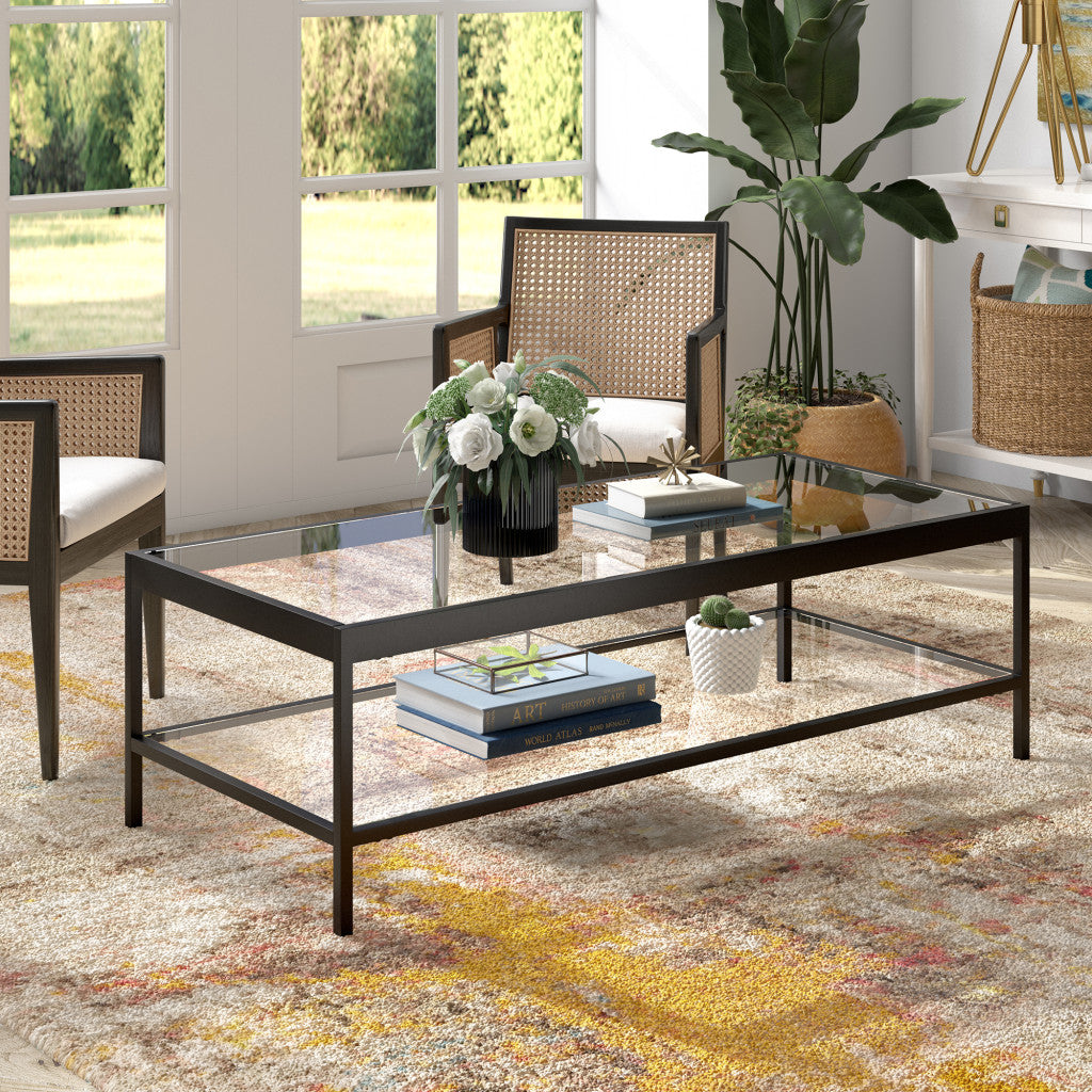 54" Clear And Black Glass And Steel Coffee Table With Shelf