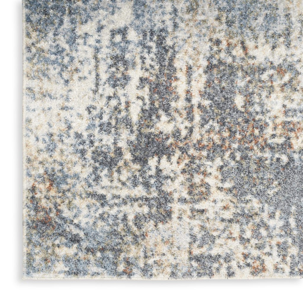 4' X 6' Blue and Ivory Abstract Power Loom Washable Area Rug
