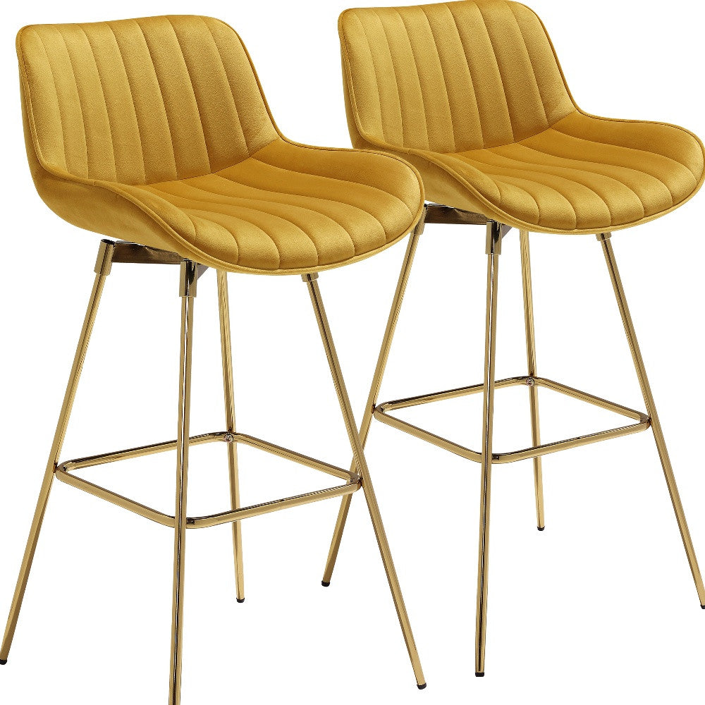 Set of Two 29" Yellow And Gold Velvet And Metal Swivel Low Back Bar Height Bar Chairs