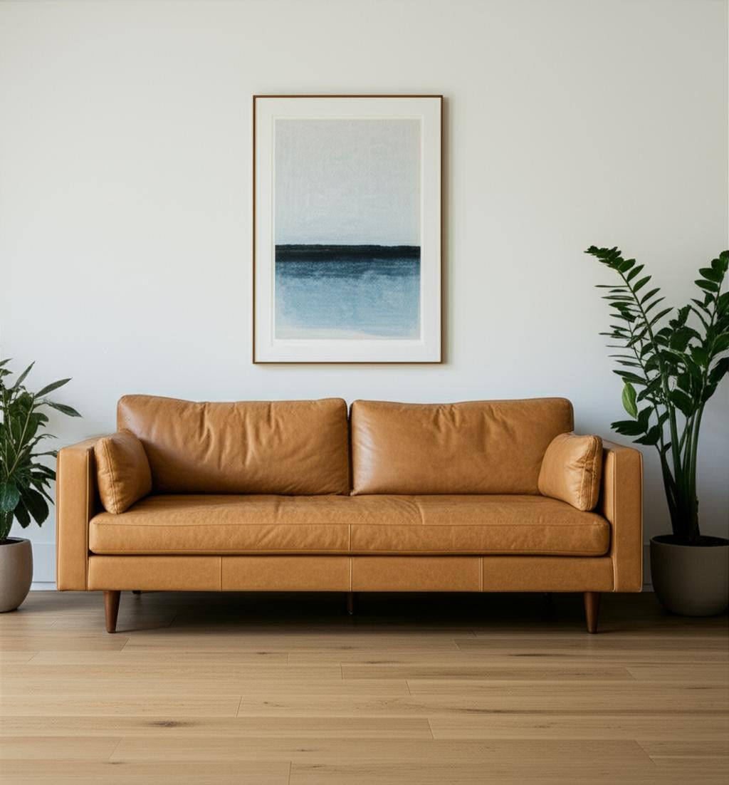 88" Tan Leather Sofa And Toss Pillows With Brown Legs