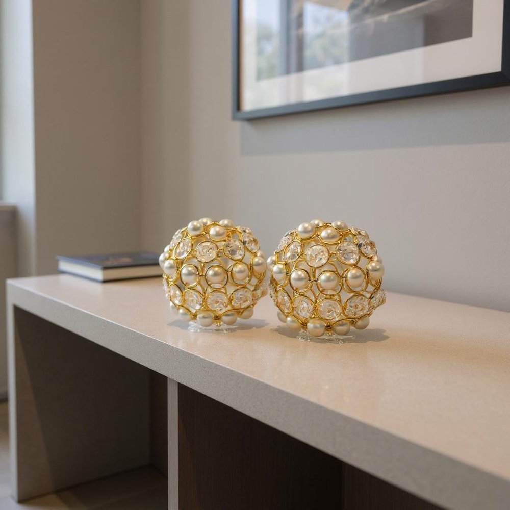 Set of Two Gold Ivory And Pearl Faux Crystal And Metal Decorative Orbs