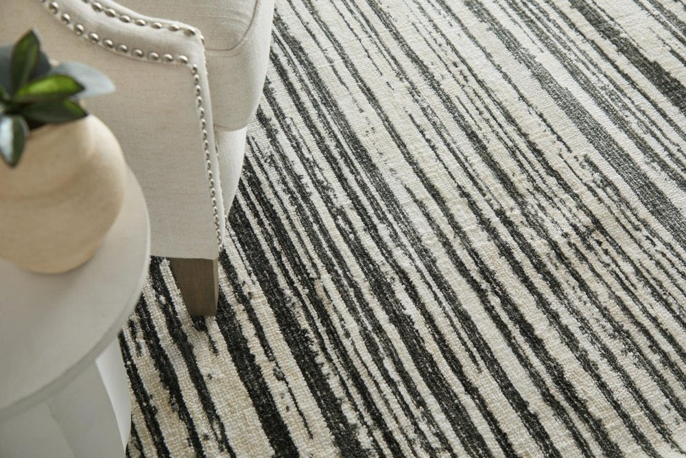 9' X 13' Black And Ivory Abstract Area Rug
