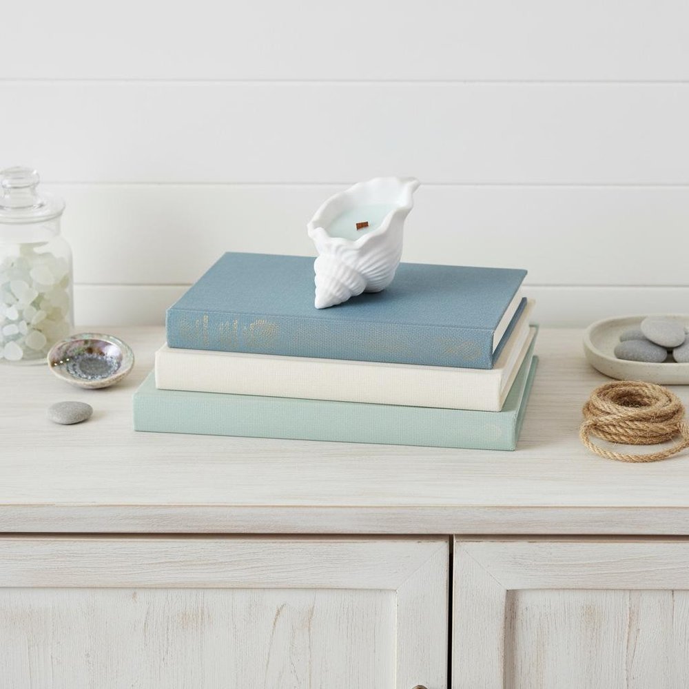 6" Light Blue Sea Salt And Orchid Scented Soy Wax Candle In White Resin Novelty Holder