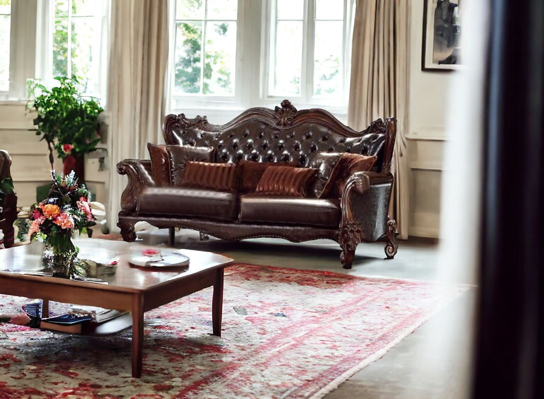 93" Brown Faux Leather Sofa And Toss Pillows With Burgundy Legs